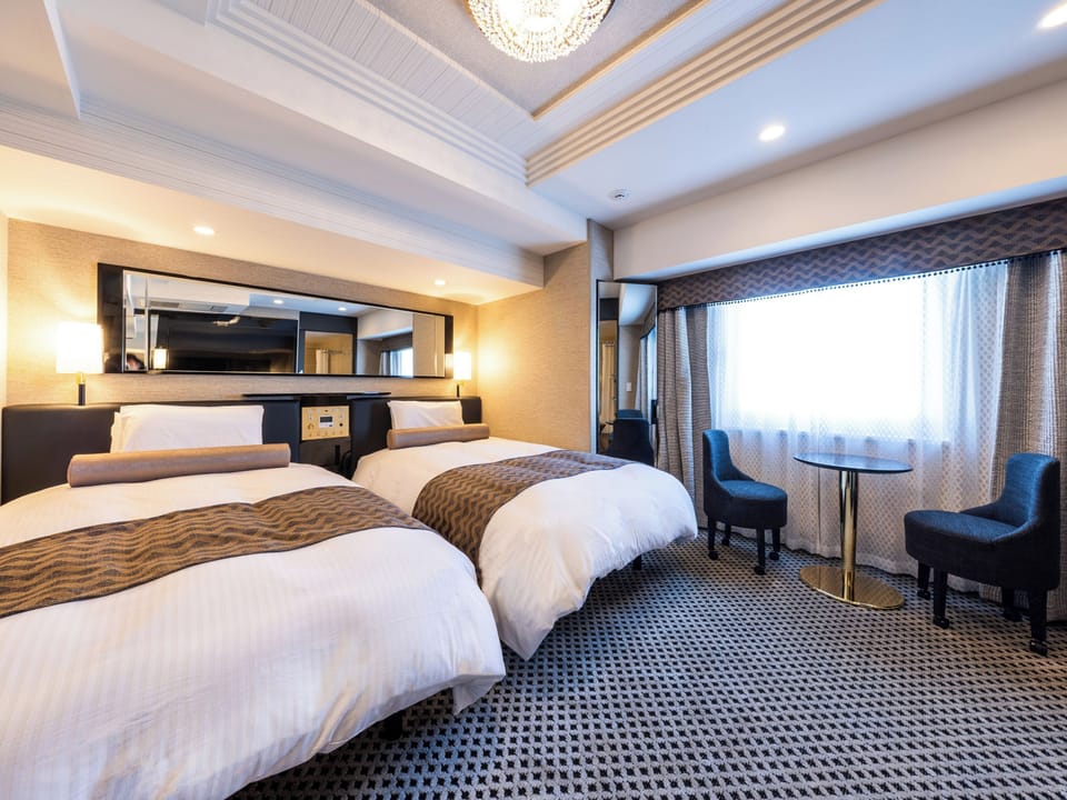 Deluxe Twin Room, Non Smoking | Down comforters, desk, laptop workspace, blackout drapes