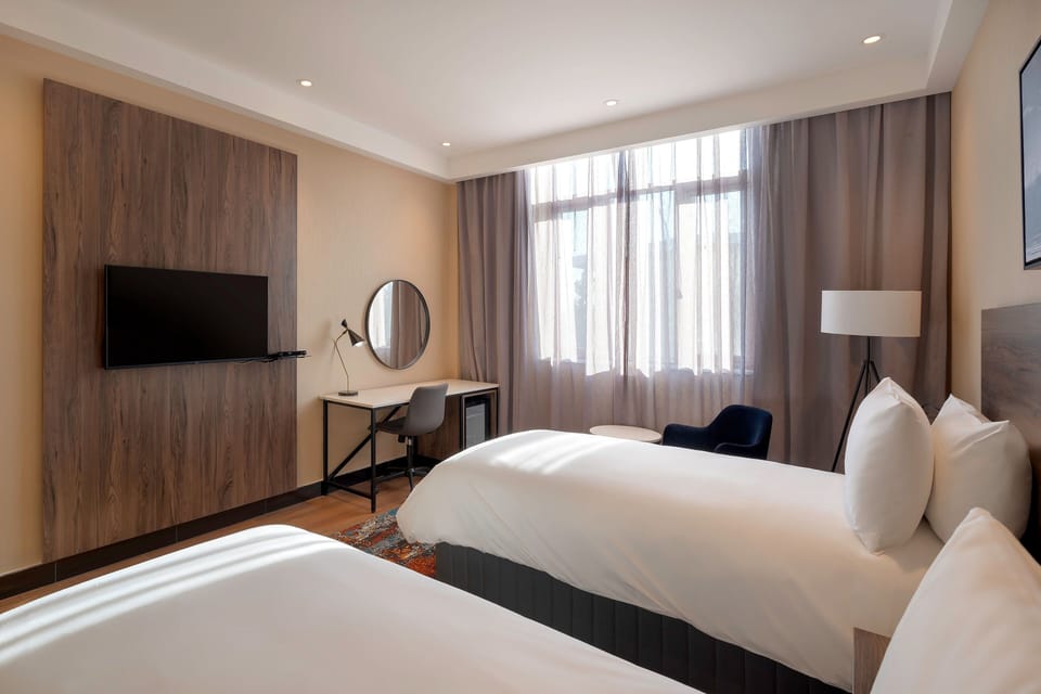 Room, 2 Twin Beds, Garden View | Minibar, desk, laptop workspace, blackout drapes
