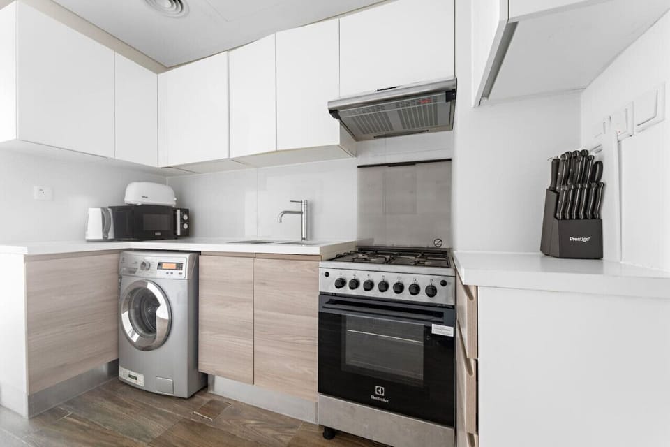 Kitchen: Modern appliances and sleek design make meal prep a delight in this stylish space!
