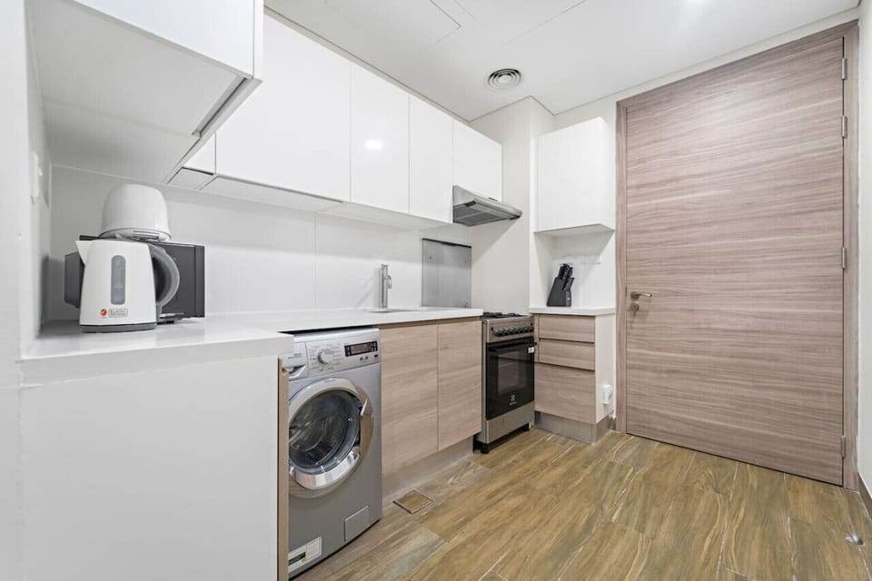 Kitchen: Modern design with sleek appliances for a delightful cooking experience!