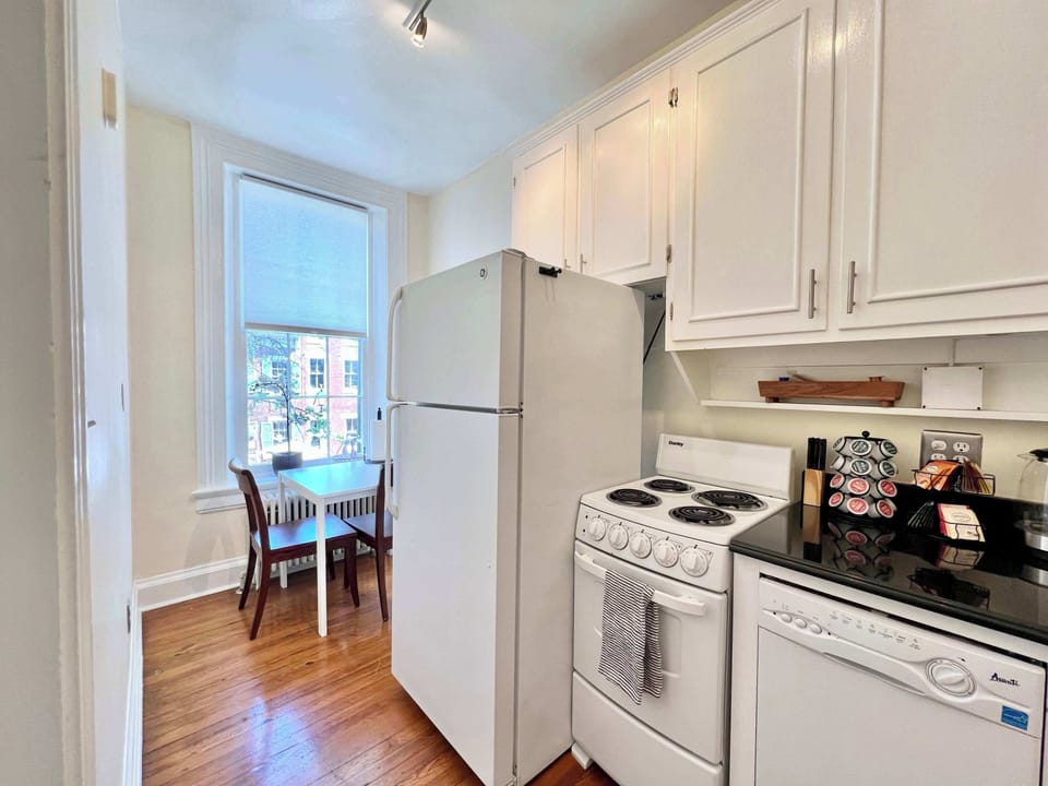 Whip up your favorite meals in this cozy, fully-equipped kitchen, set within a charming Old Town Alexandria apartment that's a stroll away from local food markets and culinary delights.