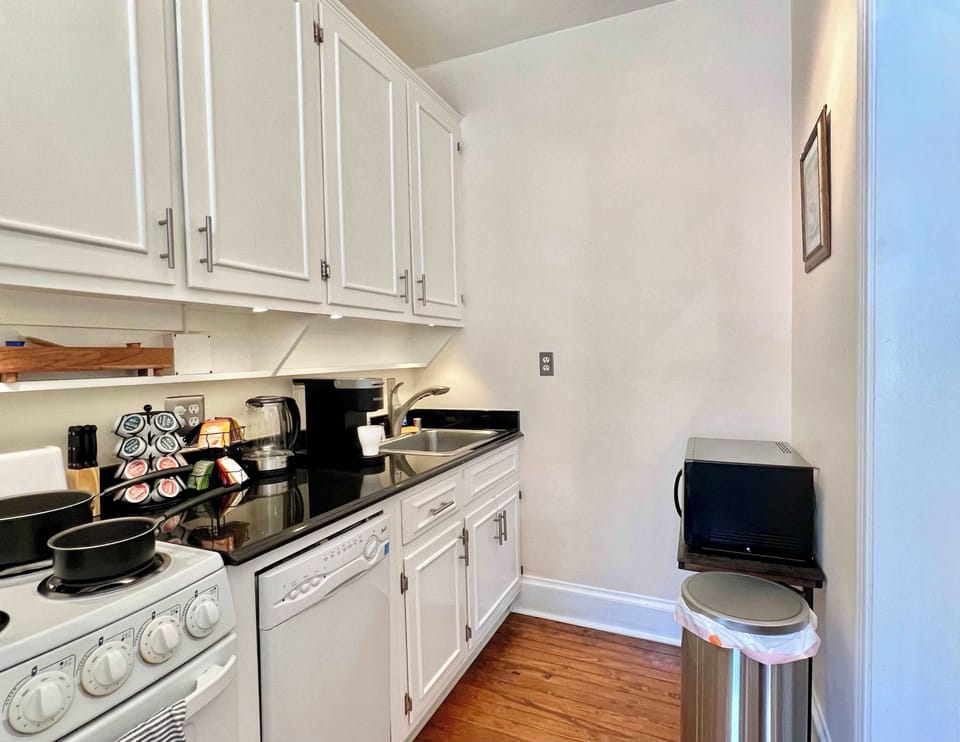 Whip up your favorite meals in this cozy, fully-equipped kitchen, set within a charming Old Town Alexandria apartment that's a stroll away from local food markets and culinary delights.