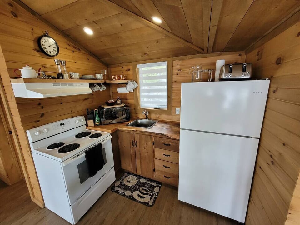 Kitchen with Fridge and stove with various small appliances for your use