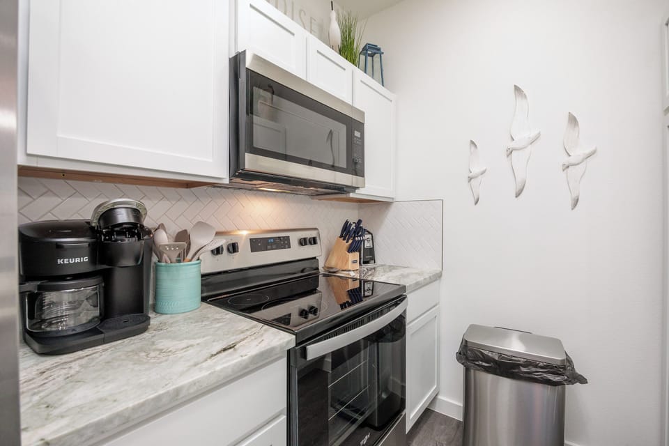 Your fully equipped kitchen features modern appliances, marble countertops, and everything needed to prepare meals during your stay.