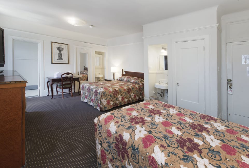 Suite, 2 Double Beds | In-room safe, iron/ironing board, free WiFi, bed sheets