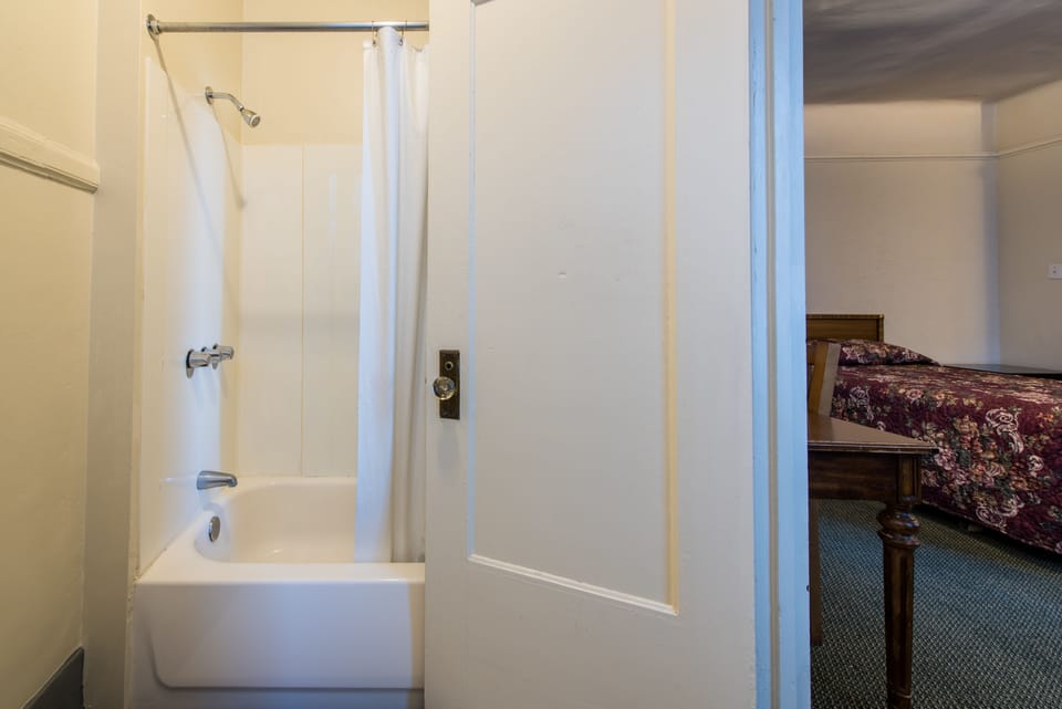 Suite, 2 Double Beds | Bathroom | Hair dryer, towels