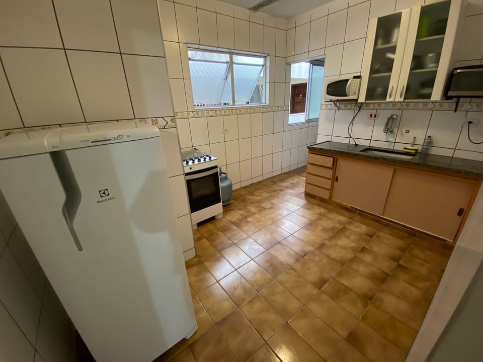 Apartment | Private kitchen | Cookware/dishes/utensils, cleaning supplies, dining tables