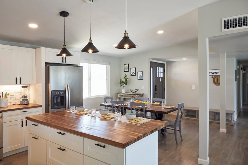 The modern kitchen is just steps away from the dining table.