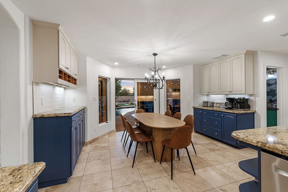 Breakfast nook opens to backyard—steps from sunshine, coffee & pool fun.

