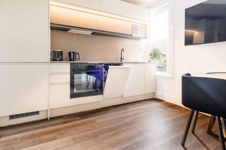 Complete with a stone worktop for all your chef-like chopping, an induction hob for fancy dinners (or just boiling pasta). Who said you can’t look classy while heating beans on toast?  Who said kitchens can’t have personality?