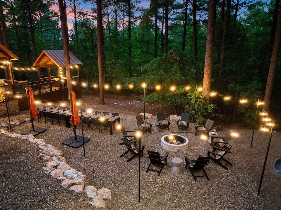 Amazing 22-person Outdoor Dining & Fire Pit surrounded by gorgeous string lights