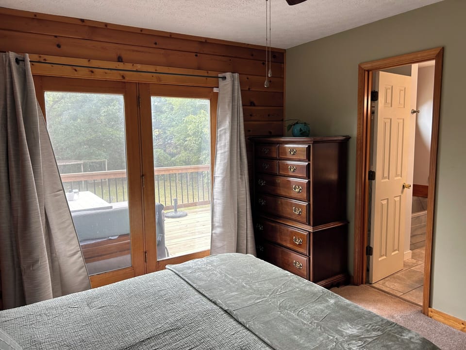 upstairs master, opens to back deck
