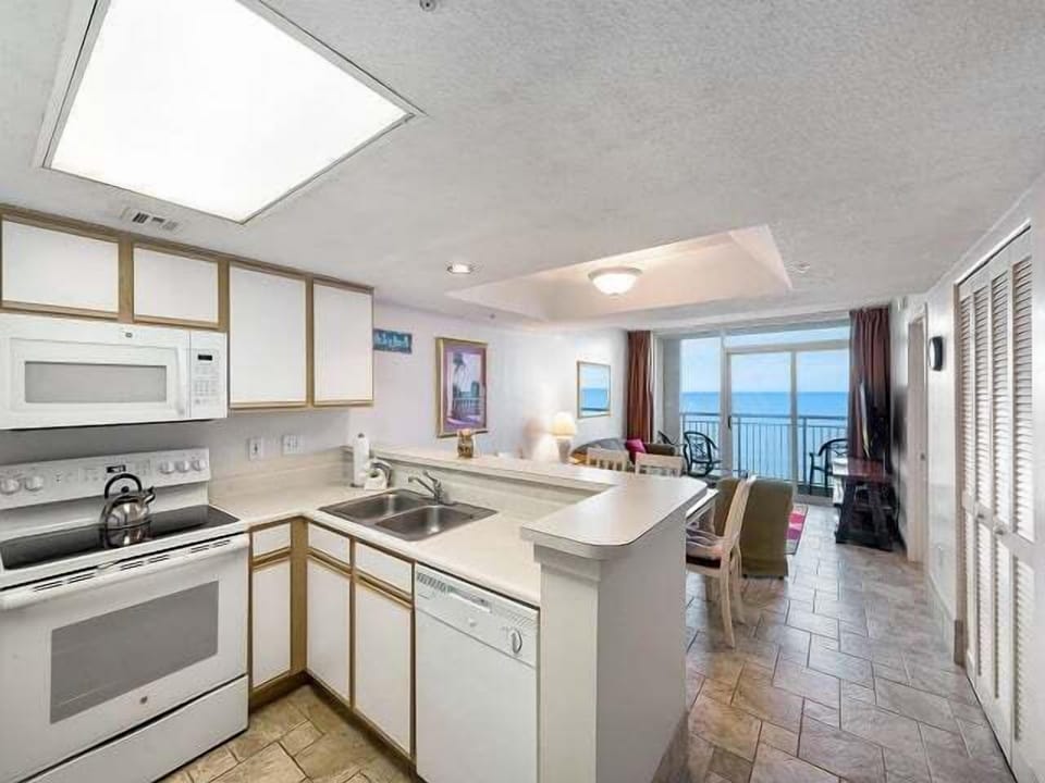 Kitchen - Kitchen with full appliances, cookware, and counter space for preparing meals during your stay.