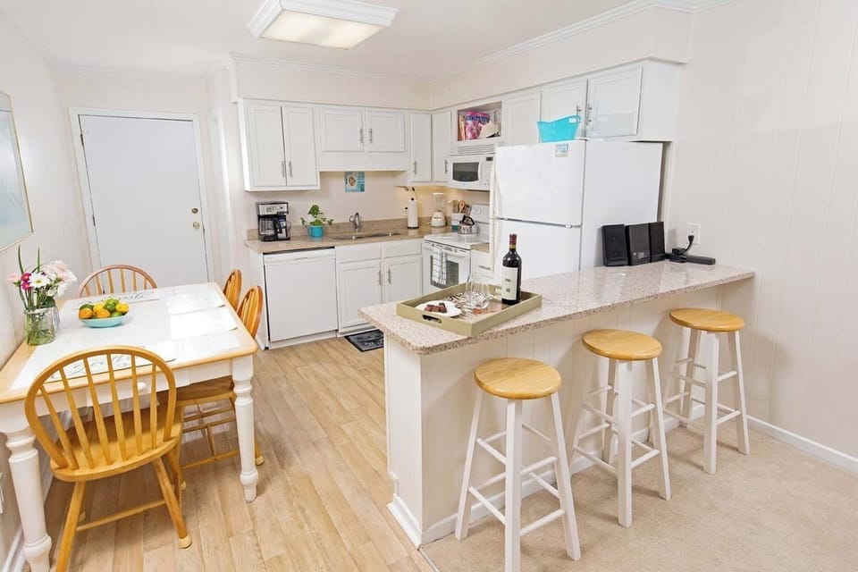 Enjoy meals together at the dining table, just steps from the kitchen and living room.