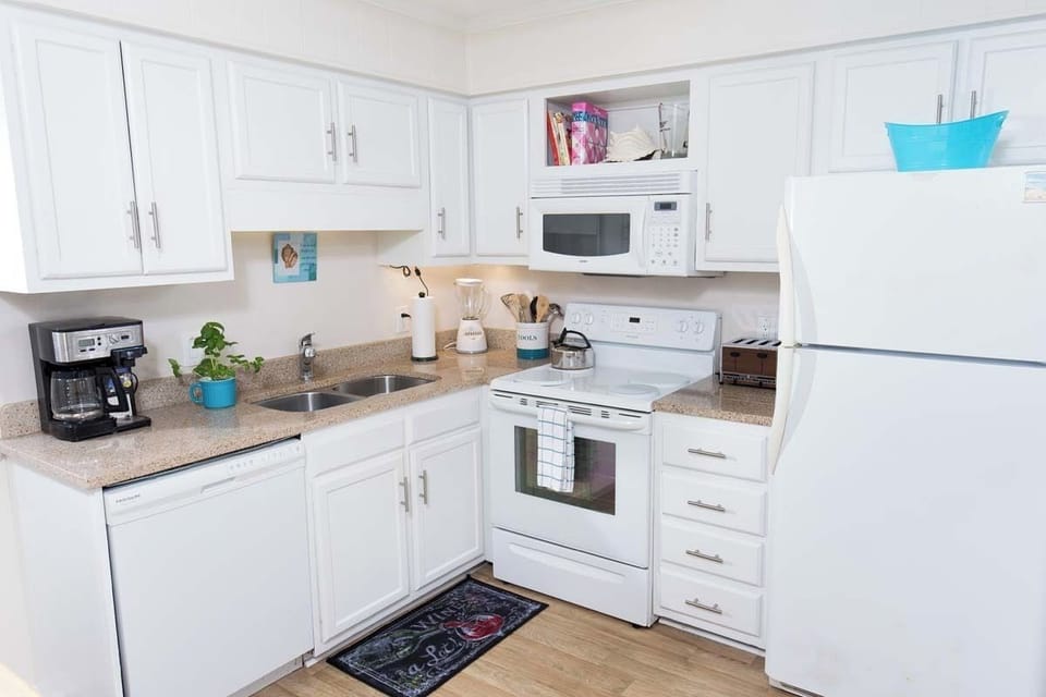 Kitchen - Kitchen with full-size appliances, cookware, and utensils — everything you need to prepare home-cooked meals during your vacation.