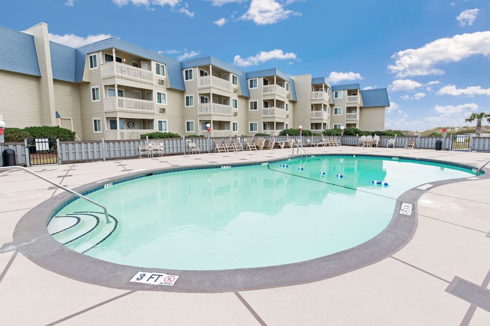 Outdoor Community Pool - Take a refreshing dip in the outdoor pool — a perfect way to cool off after time on the beach or poolside lounging with family.