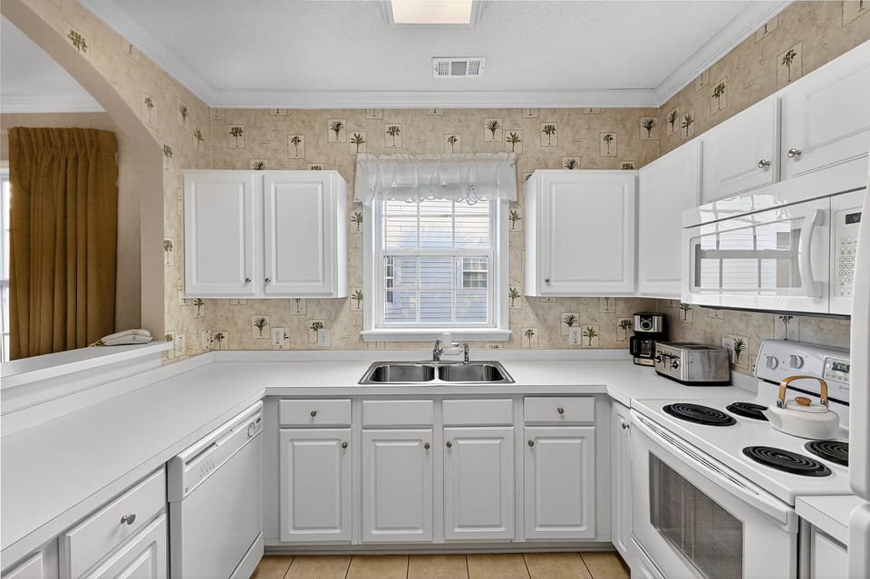 Kitchen - Cook easily in the full kitchen with major appliances, cookware, and all essentials for meal preparation during your stay.