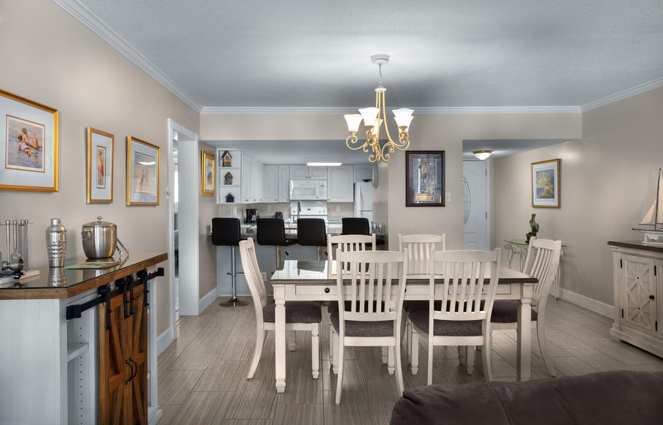 Dining Area - Dining table located next to the living area and kitchen, providing space for meals, games, or gathering together.