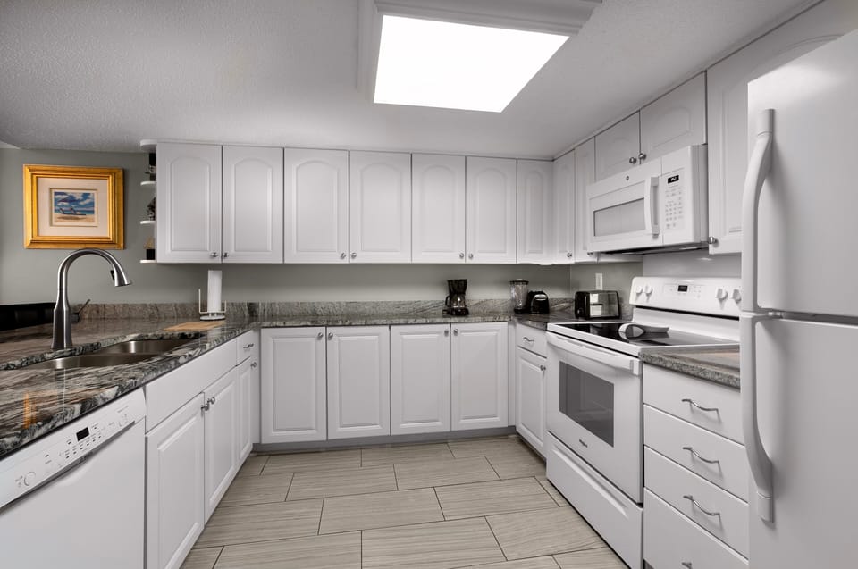 Kitchen - Kitchen with full appliances, cookware, and counter space for preparing meals during your stay.