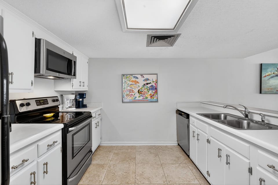 Kitchen - Kitchen with full appliances, cookware, and counter space for preparing meals during your stay.