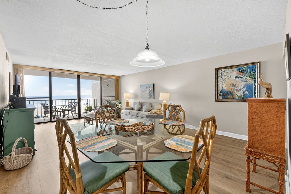 Dining Area - Dining table located beside the living room and kitchen, providing space for meals or gathering together.