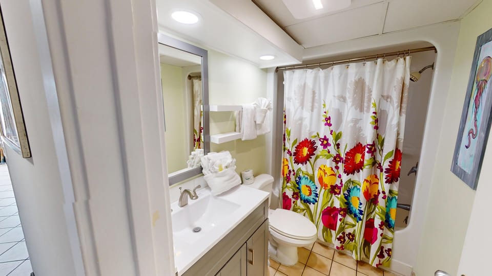 Bathroom - Clean, functional bathroom with fresh towels and toiletries provided.