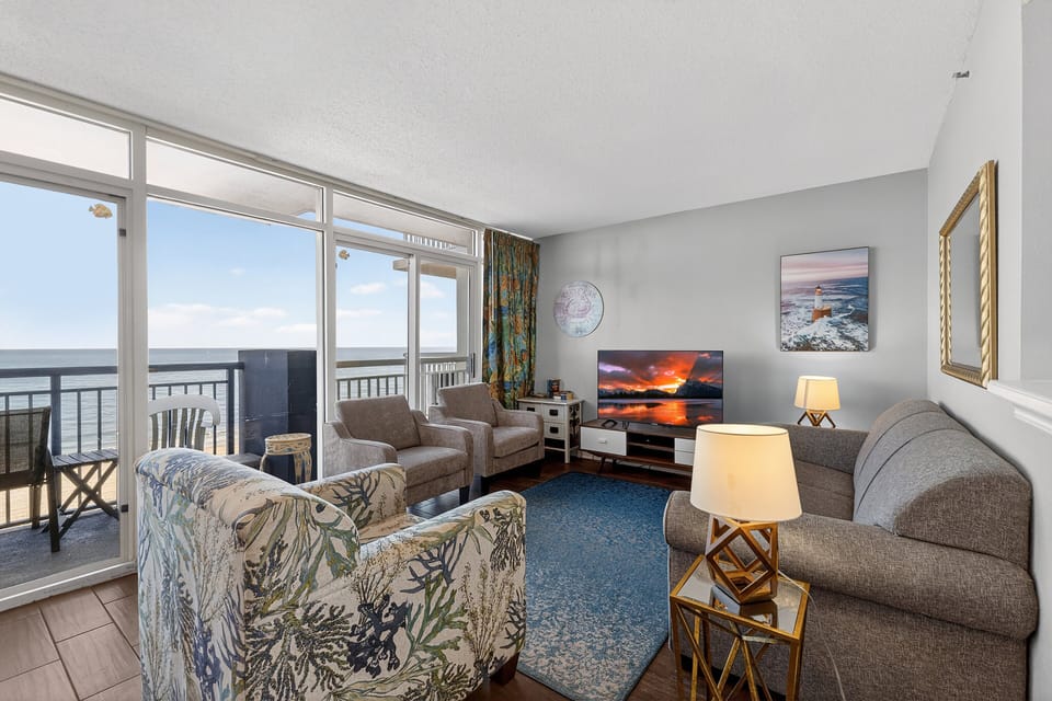 Living Room - Relax with family or friends in the open living space, complete with flat-panel TVs and plenty of seating.