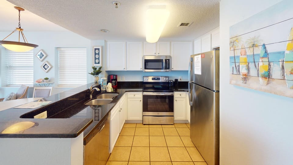 Kitchen - Prepare family meals with ease in the full kitchen, complete with modern appliances and cookware.
