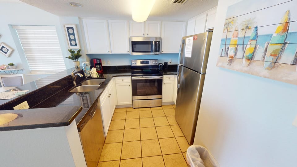 Kitchen - Prepare family meals with ease in the full kitchen, complete with modern appliances and cookware.