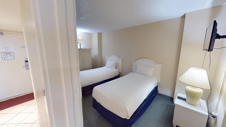 Bedroom Two - Perfect for kids or additional guests — a welcoming second bedroom with comfortable beds.