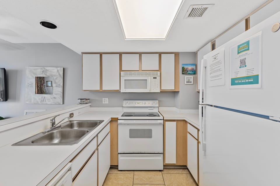 Kitchen - Prepare meals easily in your full kitchen featuring oven, stove, refrigerator, dishwasher, and essential cookware.