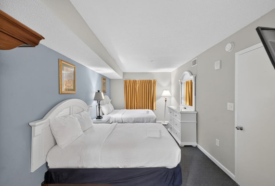 Bedroom 1 - Rest and recharge in your roomy master bedroom with cozy bedding and relaxing ambiance.
