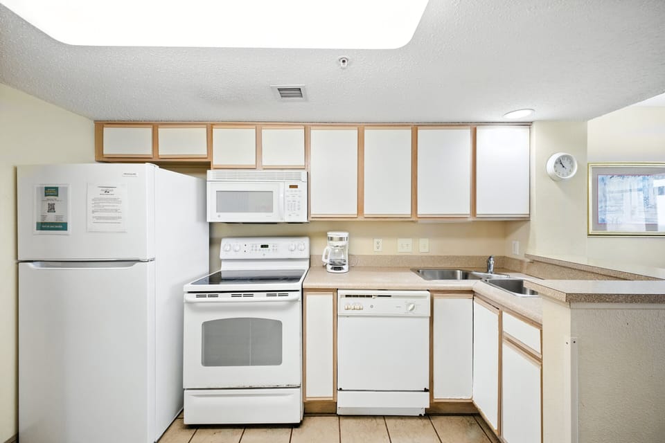 Kitchen - Whip up breakfast or dinner in the fully equipped kitchen with stove, oven, dishwasher, coffee maker, and more.