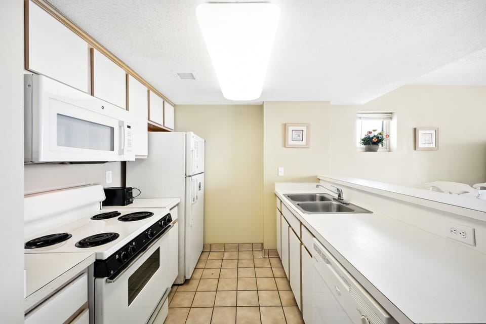 Kitchen - Full kitchen with major appliances and cookware — great for preparing meals and snacks during your vacation.