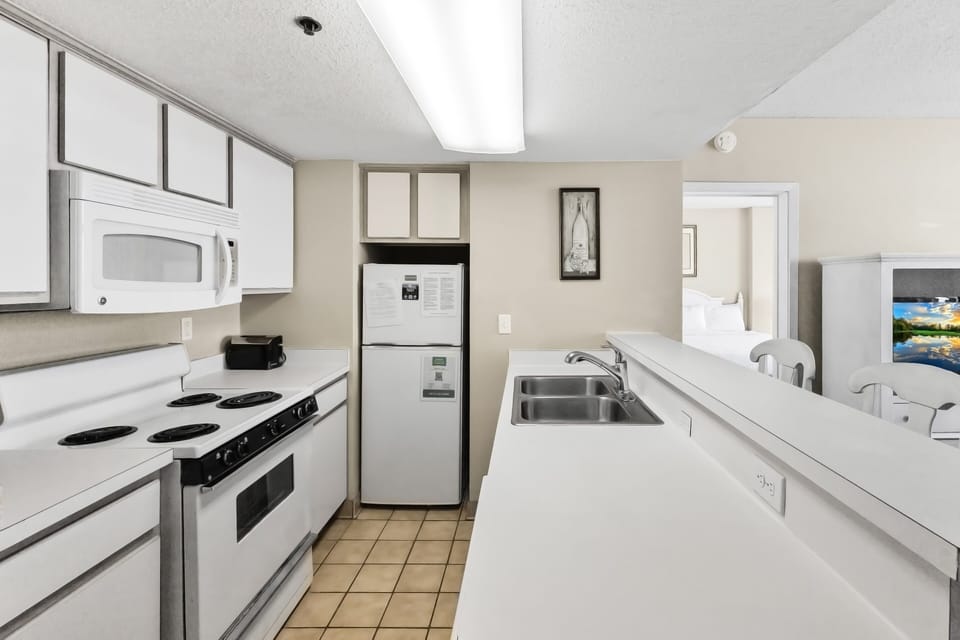 Kitchen - Full kitchen featuring essential appliances, cookware, and utensils so you can prepare meals and snacks with ease.