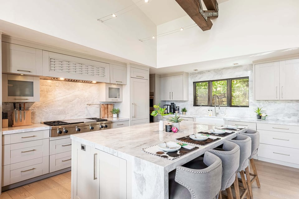 Gourmet kitchen with stone countertops and top-of-the-line stainless-steel appliances