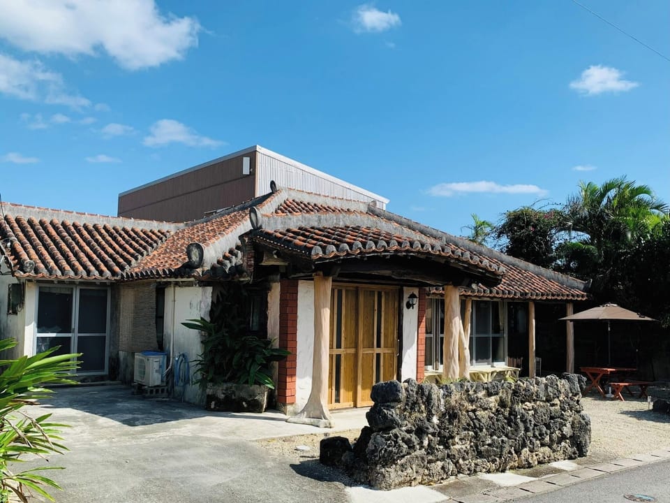 ・Main building exterior: An old-fashioned house with a distinctive red tile roof