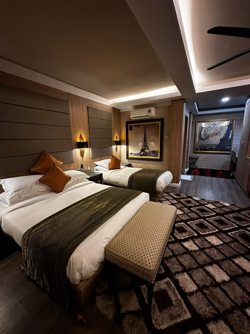 Premium Triple Room, Garden View | Desk, blackout drapes, soundproofing, iron/ironing board