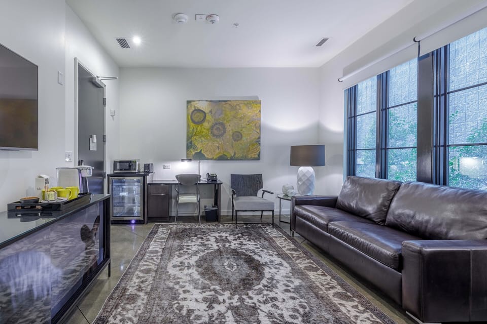 Open-concept suite with sleeper sofa.