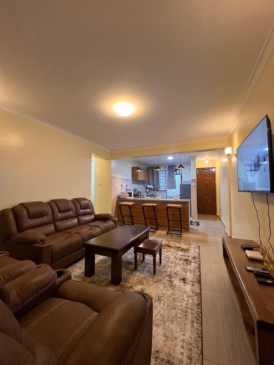 Family Apartment, Balcony, City View | Living area | 24-inch Smart TV with digital channels