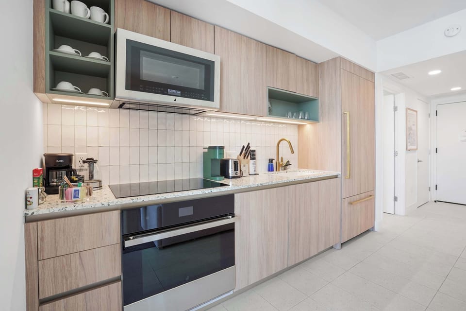 Stylish kitchen with countertops and modern fixtures.