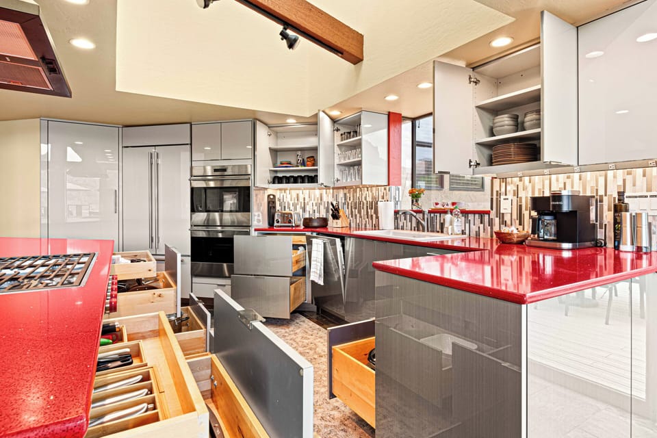 Fully Stocked Kitchen with Professional Cookware and Complete Dinnerware.