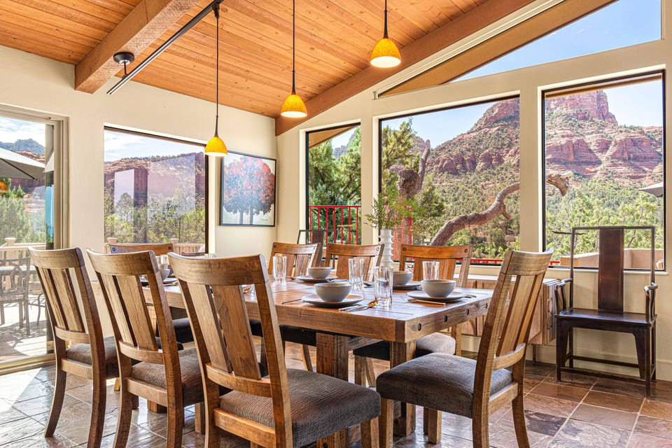 Comfortable and Modern Dining Table Complete with Dinnerware and Glasses.