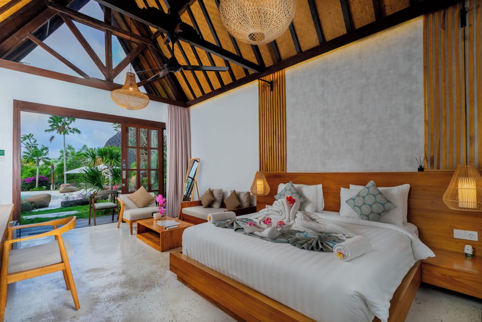 Deluxe Cottage, Patio, Pool View (Sea Facing) | Minibar, in-room safe, desk, laptop workspace