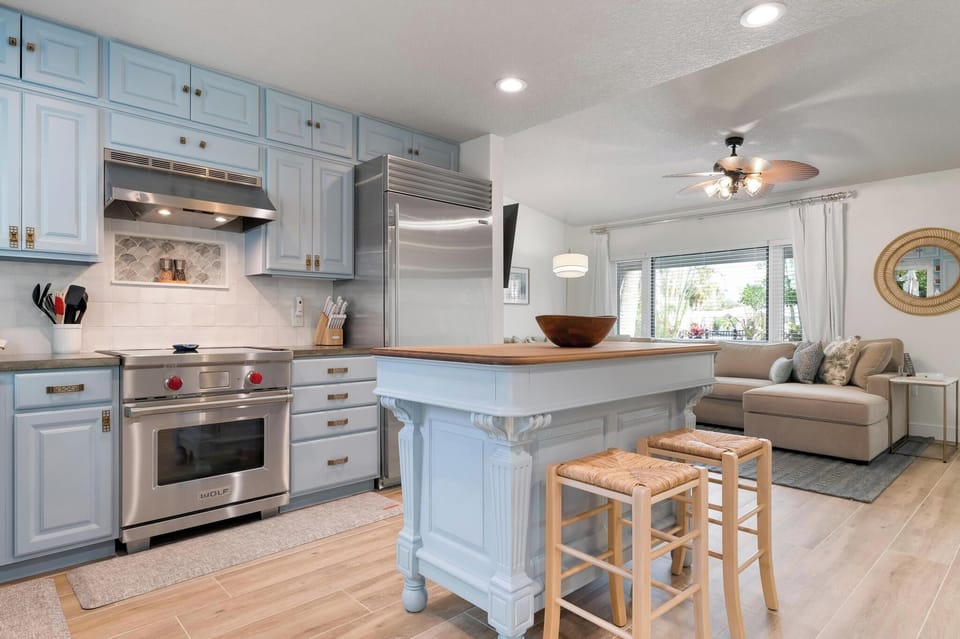 Updated coastal kitchen with soft blue accents