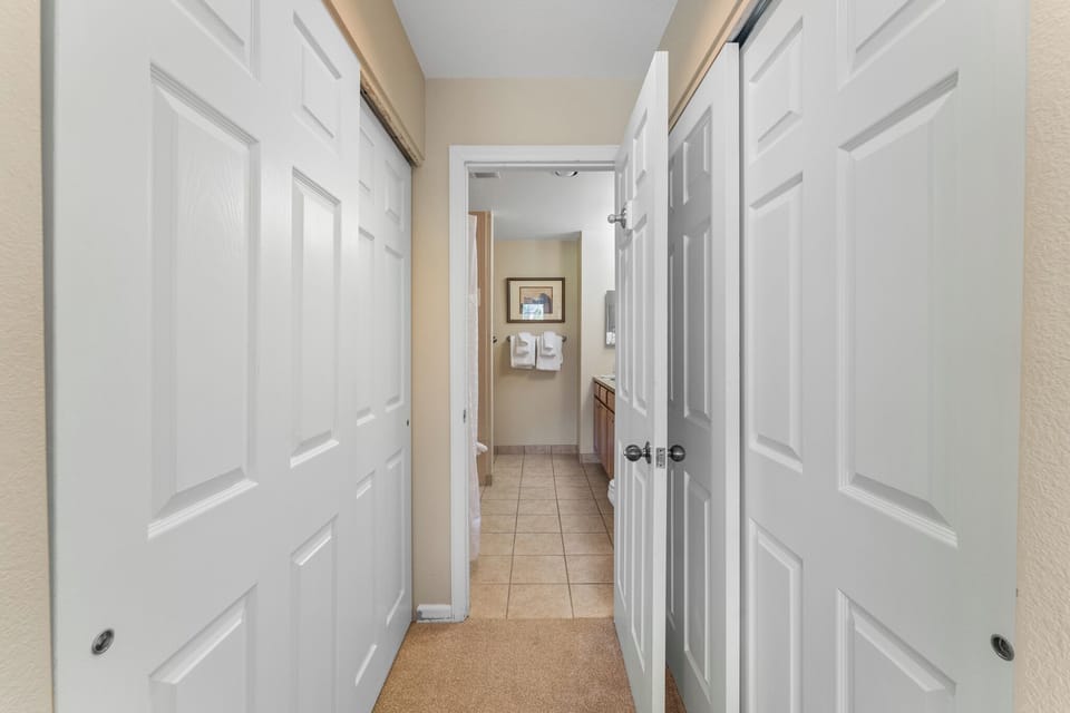 Step into your private hallway with multiple closets for all your belongings and easy access to the cozy bathroom.