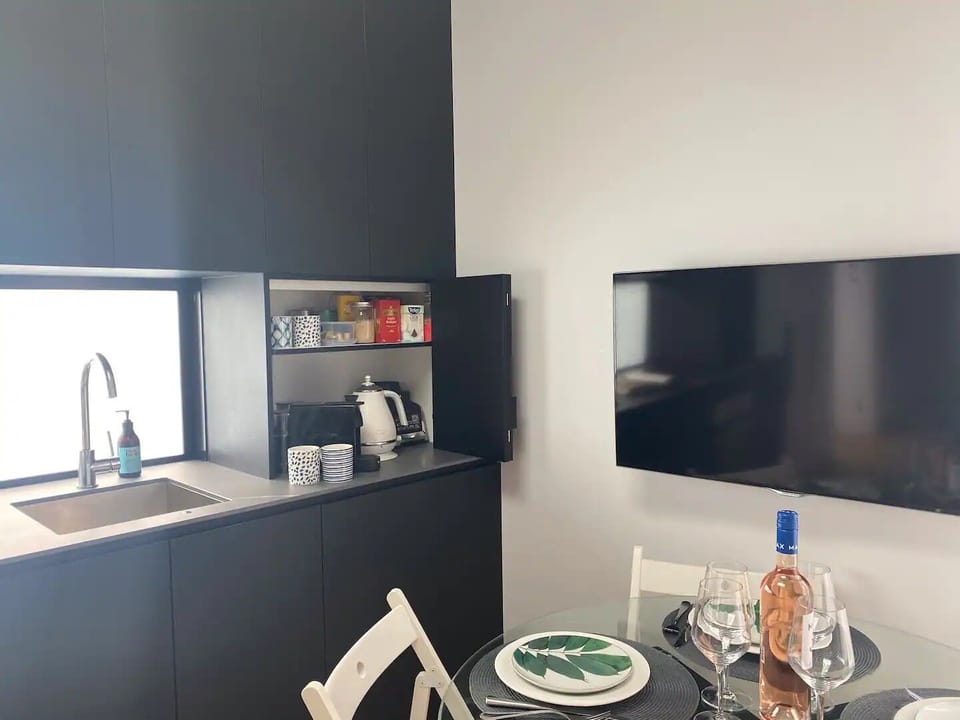 Dining table setting and fully equipped kitchen