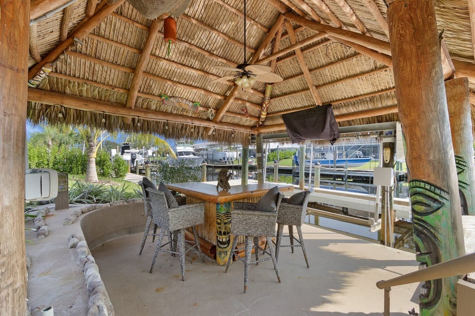 custom tiki hut, enjoy a cocktail or watch the kids fish in the canal