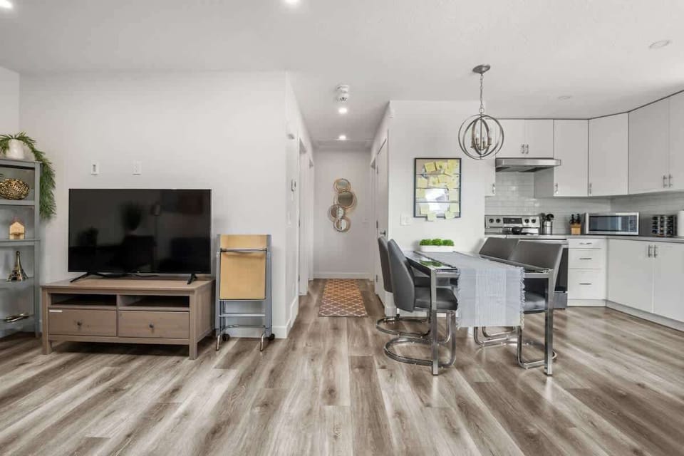 Spacious open concept living area allows guests to enjoy entertainment on the 55" Amazon Fire TV and relaxation while allowing open flow to the kitchen to cook with ease.   Tasteful decor allows Winston Suite to feel like home.