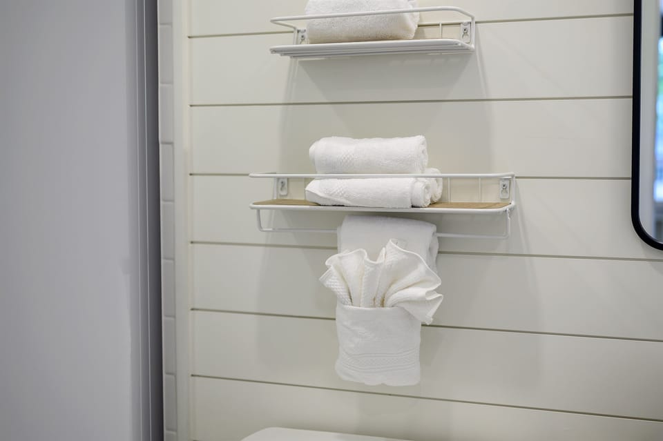 Spa-style bathroom with custom walk-in rainfall shower.